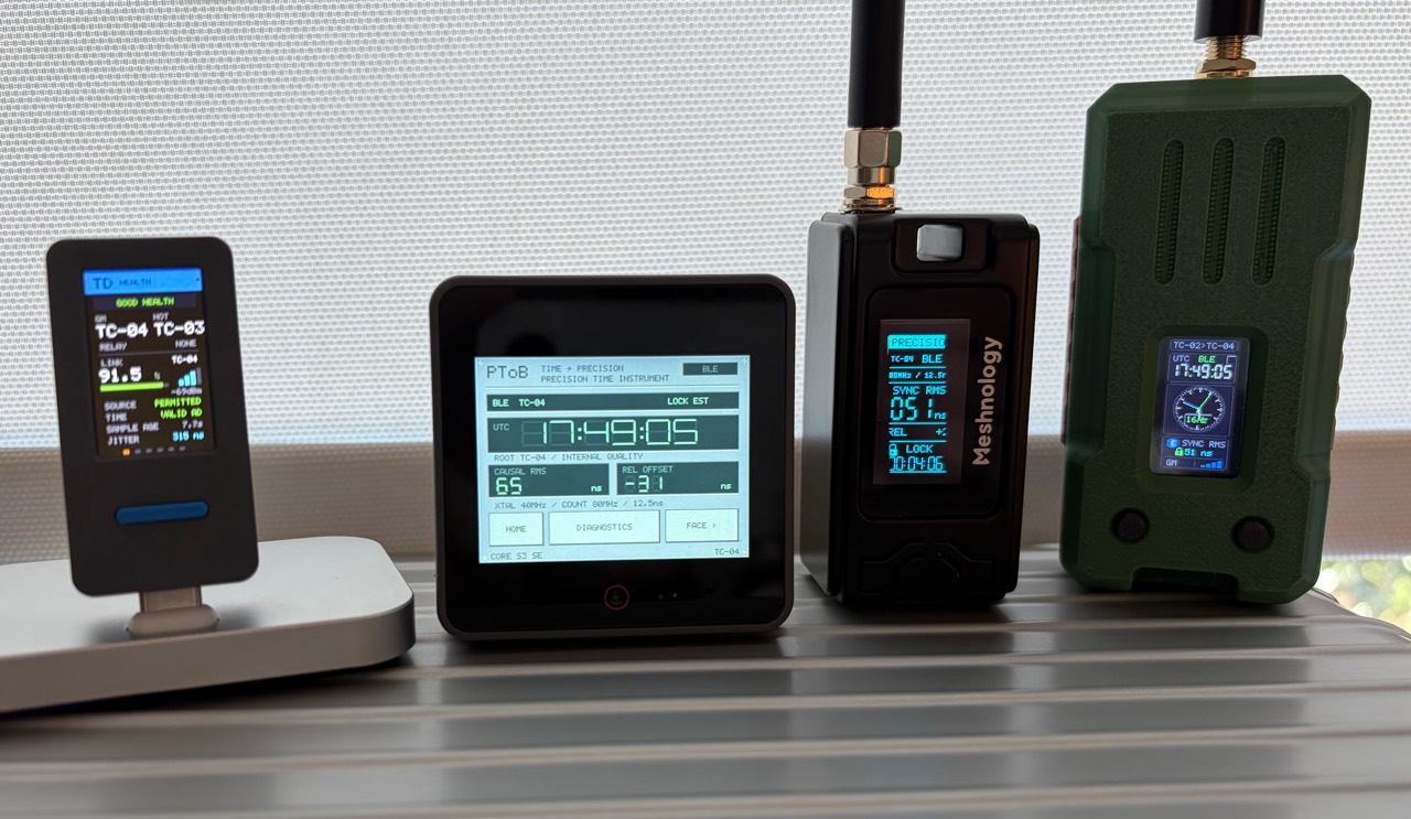 Four PToB development instruments on a windowsill, with illuminated timing and source health displays.